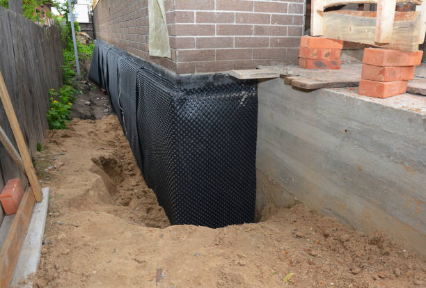 Happy homeowners after waterproofing job in Mount Ayr